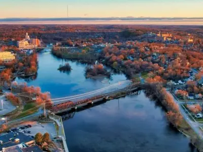Aerial of central Peterborough facing north in autumn, with Otonabee River in centre