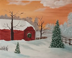 This is a peaceful winter scene. A red barn with a green Christmas wreath sits in deep snow. Snow-covered pine trees and bare trees surround it. The sky is a soft orange, like a sunset. Everything looks calm and festive, like Christmas on a quiet farm.